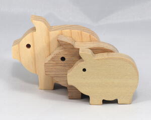Handmade wooden pig toy, sustainable wood, scroll saw cut, sanded smooth. 1.75", 2", or 2.5" sizes, natural finish for stacking or play.